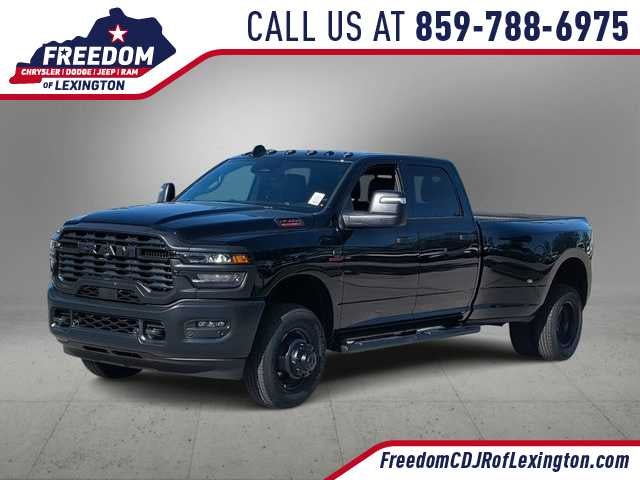 2026 RAM 3500 RAM 3500 TRADESMAN CREW CAB 4X4 8' BOX in Diamond Black Crystal Pearl-Coat Exterior Paint — front three-quarter view