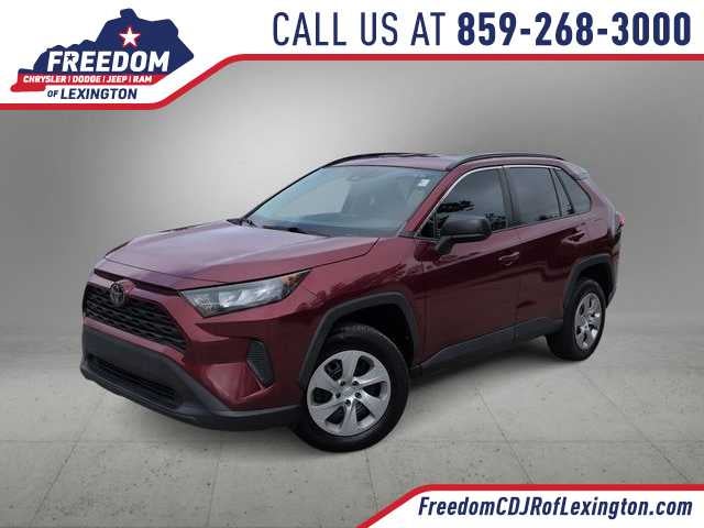 2019 Toyota RAV4 LE in Ruby Flare Pearl — front three-quarter view