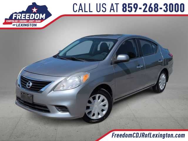 2013 Nissan Versa SV in Magnetic Gray Metallic — front three-quarter view