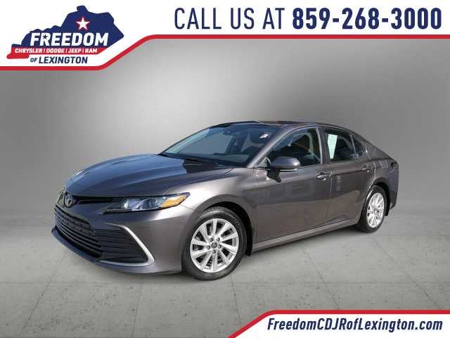2023 Toyota Camry LE in Predawn Gray Mica — front three-quarter view