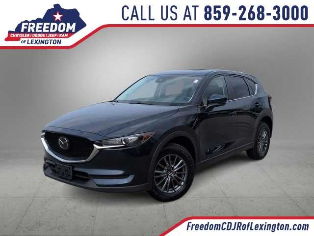 2019 Mazda Mazda CX-5 Touring in Deep Crystal Blue Mica — front three-quarter view