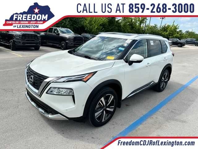 2023 Nissan Rogue Platinum in Pearl White Tricoat — front three-quarter view
